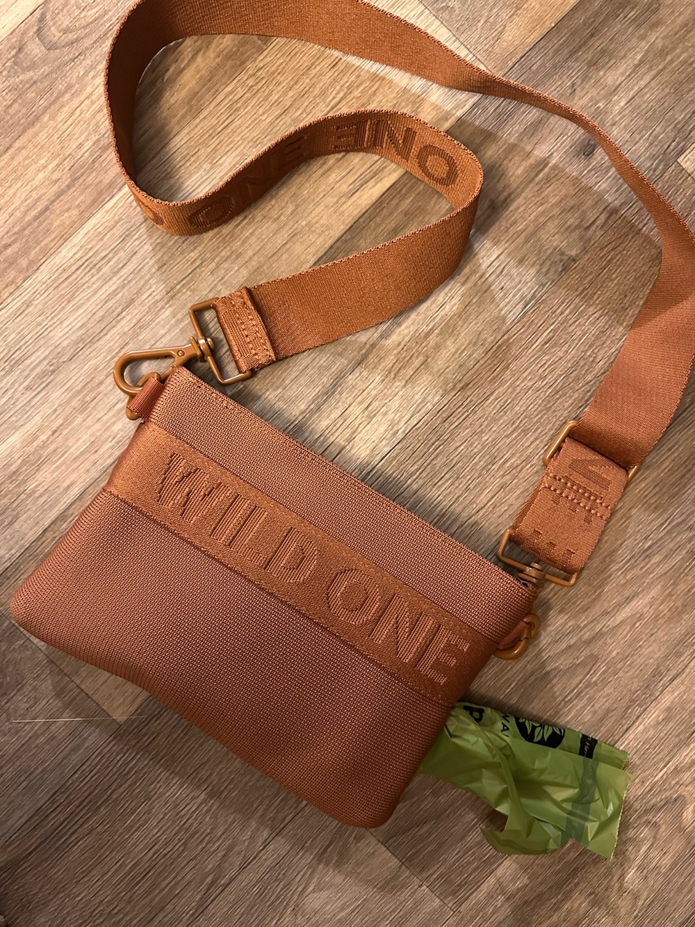 Wild One unisex Crossbody Bag dog poop bag holder in Burnt Orange with dog bags